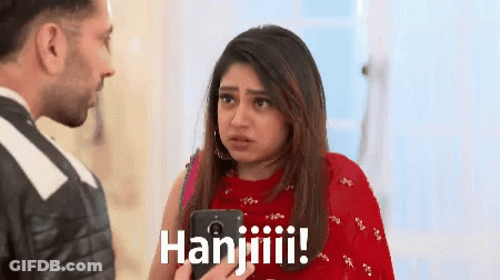 Woman In Red Dress Holding Cell Phone Says Hanjiiiii GIF