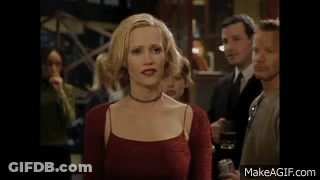 Woman In Red Dress Holding Drink GIF