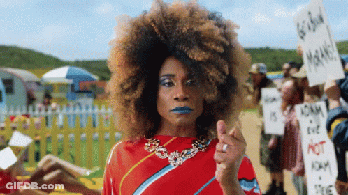 Woman In Red Dress Holding Go Back Sign GIF