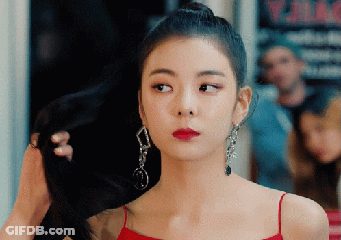 Woman In Red Dress Holding Hair Bun GIF