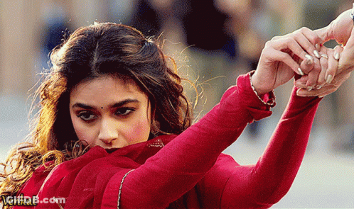 Woman In Red Dress Holding Hand Before Venkat Sign GIF