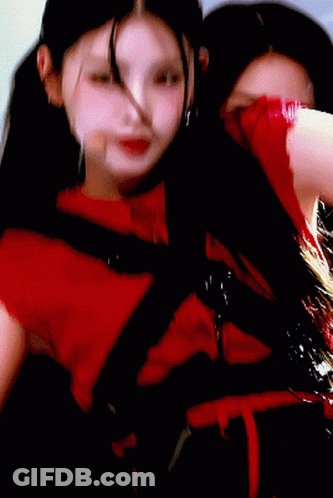 Woman In Red Dress Holding Microphone In Mouth GIF