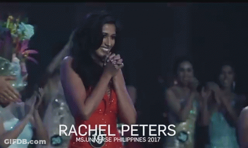 Woman In Red Dress Holding Microphone On Stage GIF