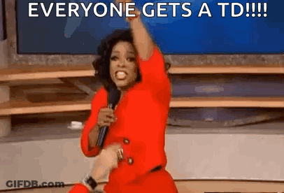 Woman In Red Dress Holding Microphone Saying Everyone Gets A TD GIF