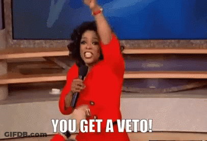 Woman In Red Dress Holding Microphone Saying You Get A Veto GIF