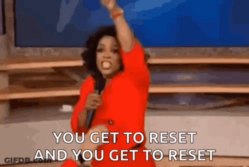 Woman In Red Dress Holding Microphone Saying You Get To Reset GIF