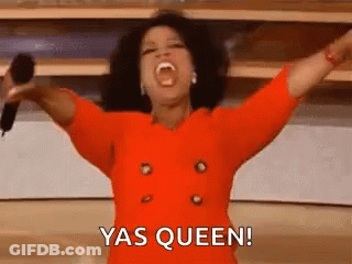 Woman In Red Dress Holding Microphone With Arms Up GIF