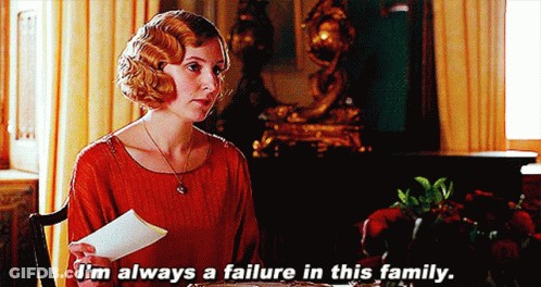 Woman In Red Dress Holding Paper Says I'm Always A Failure In This Family GIF