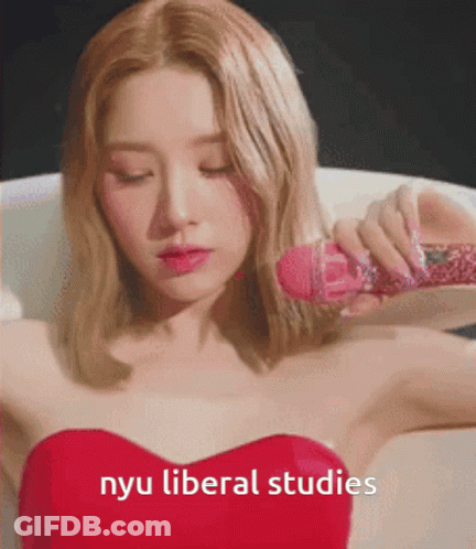 Woman In Red Dress Holding Pink Microphone NYU Liberal Studies GIF