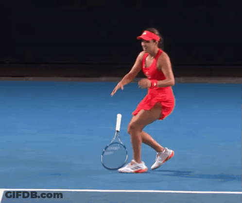 Woman In Red Dress Holding Tennis Racquet GIF