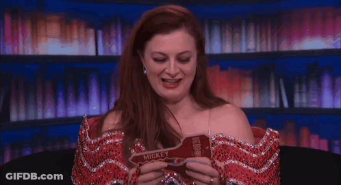 Woman In Red Dress Holds Key Saying Kelley GIF