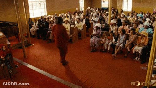 Woman In Red Dress In Church Saying Bounty GIF