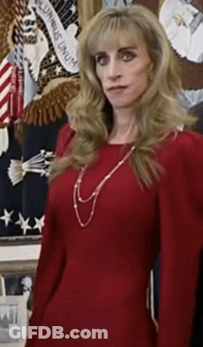 Woman In Red Dress In Front Of American Flag GIF