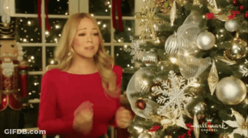 Woman In Red Dress In Front Of Christmas Tree Hallmark Channel GIF