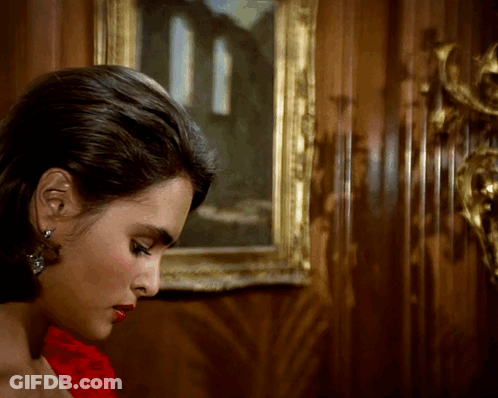 Woman In Red Dress In Front Of Painting GIF