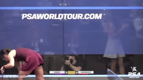 Woman In Red Dress In Front Of Psaworldtour.com Screen GIF