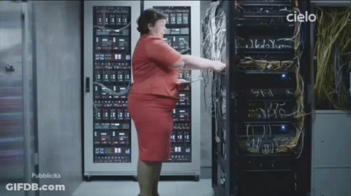 Woman In Red Dress In Front Of Server Rack With Cielo GIF