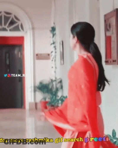 Woman In Red Dress In Hallway For More Rashmika GIF Search Preeti GIF