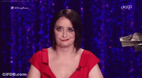 Woman In Red Dress Making Funny Face GIF