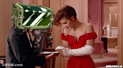 Woman In Red Dress Next To Man With Green Box Saying Gifmemes.io GIF