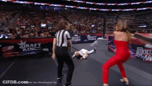 Woman In Red Dress Next To Referee GIF
