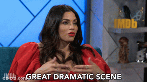 Woman In Red Dress On Blue Couch Saying Great Dramatic Scene GIF