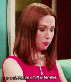 Woman In Red Dress On Blue Couch Says Being An Adult Is Terrible GIF