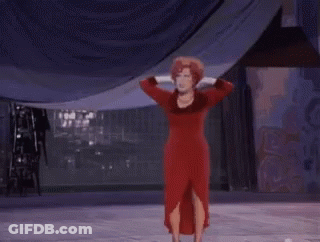Woman In Red Dress On Stage Hands On Head GIF