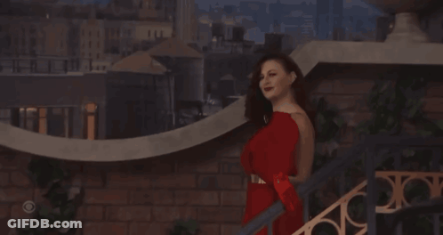 Woman In Red Dress On Stairs GIF