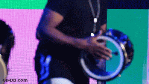 Woman In Red Dress Playing Ludwig Drums GIF