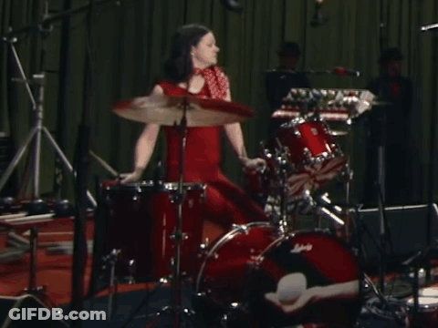 Woman In Red Dress Playing Ludwig Drums GIF