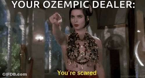 Woman In Red Dress Pointing At Camera Saying Your Ozempic Dealer You're Scared GIF