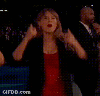 Woman In Red Dress Raising Fist GIF