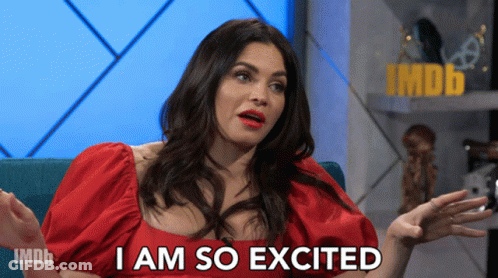 Woman In Red Dress Saying I Am So Excited Imdb Logo GIF