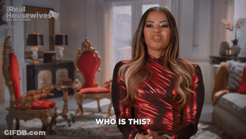 Woman In Red Dress Saying Who Is This GIF
