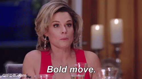 Woman In Red Dress Says Bold Move With Wine And Candles GIF
