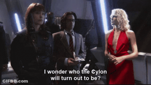 Woman In Red Dress Says I Wonder Who The Cylon Will Turn Out To Be GIF