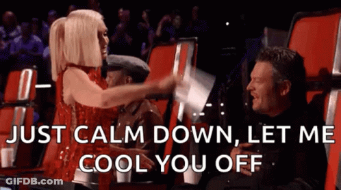Woman In Red Dress Says Just Calm Down Let Me Cool You Off Next To Man In Black Shirt GIF
