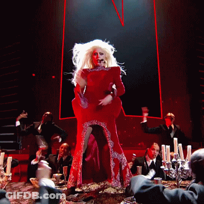 Woman In Red Dress Singing Into Microphone GIF