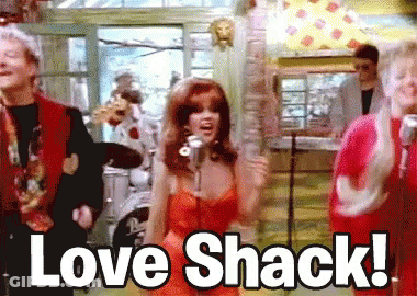 Woman In Red Dress Singing Love Shack GIF