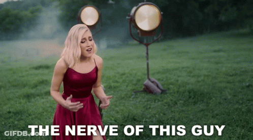 Woman In Red Dress Singing The Nerve Of This Guy GIF