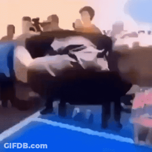 Woman In Red Dress Sitting At Table GIF