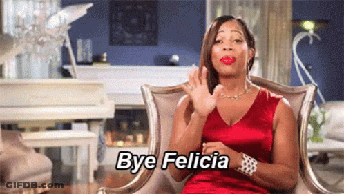 Woman In Red Dress Sitting In Living Room GIF