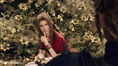 Woman In Red Dress Sitting In Yellow Flowers GIF
