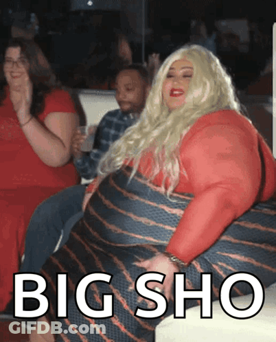 Woman In Red Dress Sitting On Couch Saying Big Sho GIF