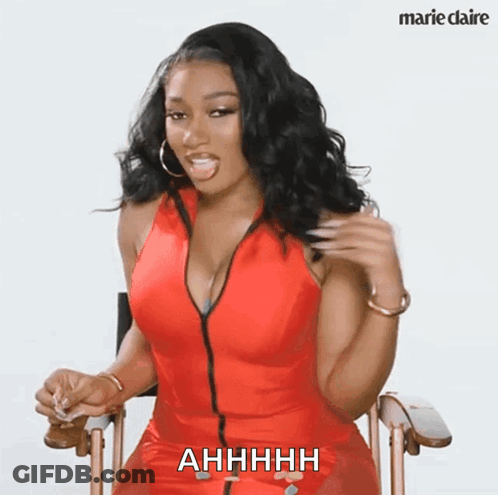 Woman In Red Dress Sitting Saying Ahhhh GIF