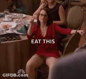 Woman In Red Dress Sitting With Wine GIF