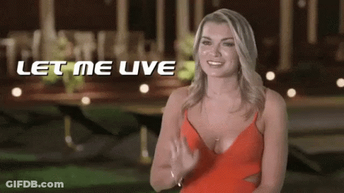 Woman In Red Dress Smiling And Waving GIF
