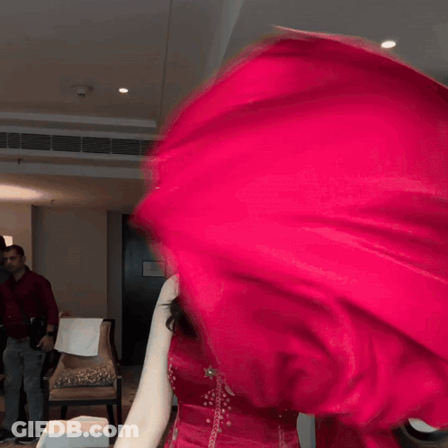 Woman In Red Dress Smiling And Waving Red Cloth GIF