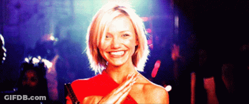 Woman In Red Dress Smiling Hands On Shoulders GIF